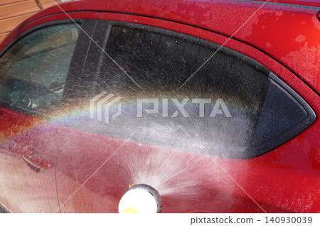 Washing a car with water (rainbow shower) 02 Washing a car with water (rainbow shower) 02 140930039