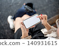 Close up of woman holding smartphone with blank screen. 140931615