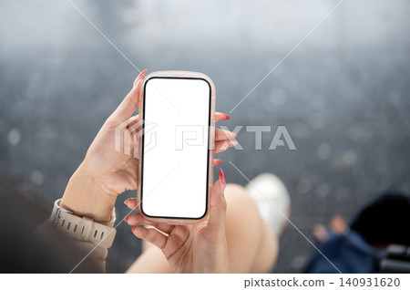 Close up of vertical smartphone mockup in woman hands. Close up of vertical smartphone mockup in woman hands. 140931620