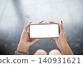 Over shoulder shot of horizontal smartphone mockup display. 140931621