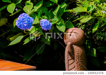 Hydrangea and stone Buddha Hydrangea and stone Buddha 140932378