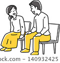 A man and a woman sitting in chairs and chatting. 140932425