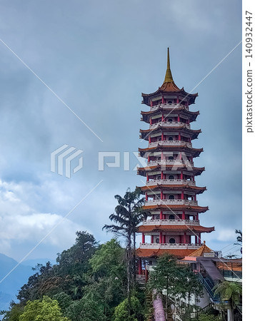 Chin Swee Caves Temple pagoda tower against cloudy sky at Genting Highlands in Pahang Malaysia Chin Swee Caves Temple pagoda tower against cloudy sky at Genting Highlands in Pahang Malaysia 140932447