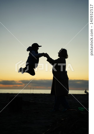 Mother and Son Silhouette at Sunset Beach Mother and Son Silhouette at Sunset Beach 140932517