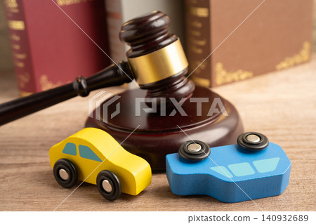 Car accident lawsuit and insurance, Judge hammer with car model. Car accident lawsuit and insurance, Judge hammer with car model. 140932689