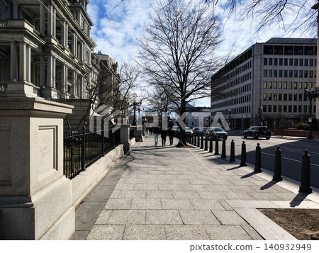 Washington Street with pedestrians strolling. On the left is a monumental historic building with columns; on the right are modern buildings. Washington Street with pedestrians strolling. On the left is a monumental historic building with columns; on the right are modern buildings. 140932949
