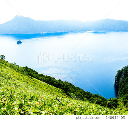 Lake Mashu, located within Akan Mashu National Park in Teshikaga Town, Hokkaido, offers a refreshing summer experience. Lake Mashu, located within Akan Mashu National Park in Teshikaga Town, Hokkaido, offers a refreshing summer experience. 140934405