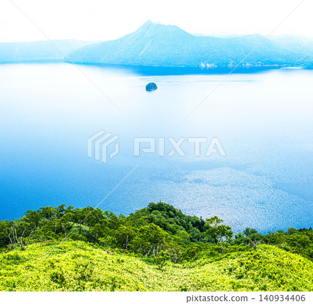 Lake Mashu, located within Akan Mashu National Park in Teshikaga Town, Hokkaido, offers a refreshing summer experience. Lake Mashu, located within Akan Mashu National Park in Teshikaga Town, Hokkaido, offers a refreshing summer experience. 140934406