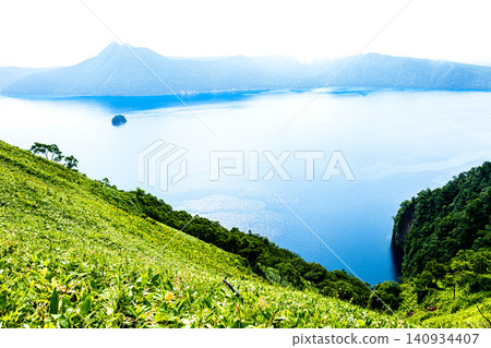 Lake Mashu, located within Akan Mashu National Park in Teshikaga Town, Hokkaido, offers a refreshing summer experience. Lake Mashu, located within Akan Mashu National Park in Teshikaga Town, Hokkaido, offers a refreshing summer experience. 140934407