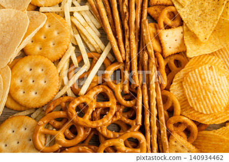 Mix of variety snack chips pretzel and cracker, junk crunchy food. Mix of variety snack chips pretzel and cracker, junk crunchy food. 140934462