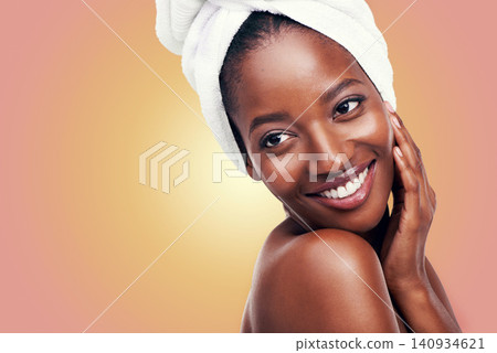 Happy woman and skincare with towel in studio for beauty, dermatology and mockup on gradient or orange background. Facial glow of a young model or African person with smile for hygiene and cosmetics Happy woman and skincare with towel in studio for beauty, dermatology and mockup on gradient or orange background. Facial glow of a young model or African person with smile for hygiene and cosmetics 140934621
