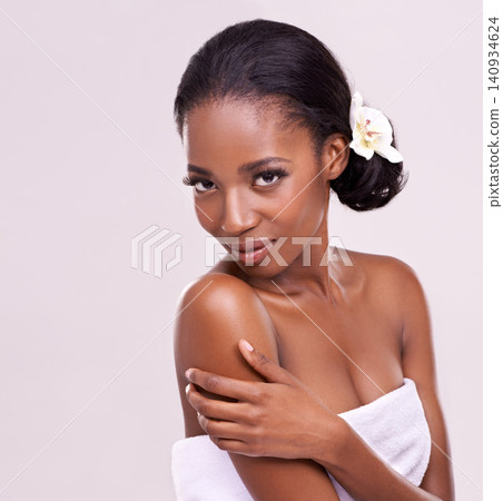 Woman, portrait and orchid for beauty in studio with cosmetics, natural glow and flower with confidence. Model, african person or face for cosmetology, facial treatment and mockup on white background Woman, portrait and orchid for beauty in studio with cosmetics, natural glow and flower with confidence. Model, african person or face for cosmetology, facial treatment and mockup on white background 140934624