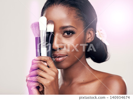 Beauty, makeup brushes and portrait of black woman with cosmetics on face in studio with application tools. Skincare, brush and cosmetic skin care model with luxury contour tool on white background. 140934674