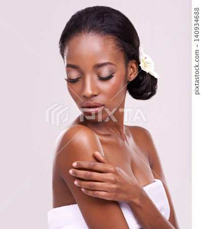 Woman, face and body for cosmetics in studio with beauty, natural glow and self care with confidence. Model, african person or flower for cosmetology, facial treatment and towel on white background Woman, face and body for cosmetics in studio with beauty, natural glow and self care with confidence. Model, african person or flower for cosmetology, facial treatment and towel on white background 140934688