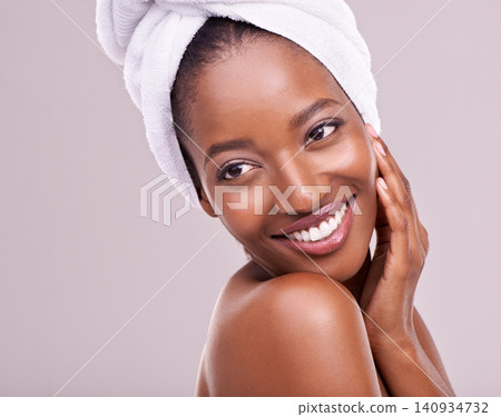 Happy, woman and skin care with towel in studio for beauty, dermatology and thinking of benefits. Soft, facial and glow of young model or African person with smile for cosmetics on a white background Happy, woman and skin care with towel in studio for beauty, dermatology and thinking of benefits. Soft, facial and glow of young model or African person with smile for cosmetics on a white background 140934732