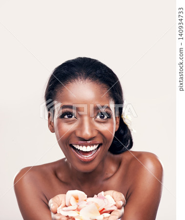 Petal, skincare and black woman laugh in studio for makeup, beauty or wellness on white background. Floral, face and African model smile with soft cosmetics, shine or organic, fun and transformation Petal, skincare and black woman laugh in studio for makeup, beauty or wellness on white background. Floral, face and African model smile with soft cosmetics, shine or organic, fun and transformation 140934733