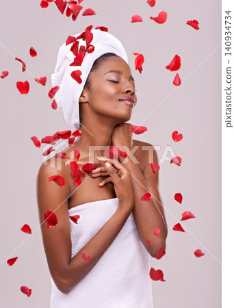 Happy, skincare and black woman with red petals, dermatology and treatment on a white studio background. Wellness, African person and model with natural beauty and grooming with luxury and aesthetic Happy, skincare and black woman with red petals, dermatology and treatment on a white studio background. Wellness, African person and model with natural beauty and grooming with luxury and aesthetic 140934734