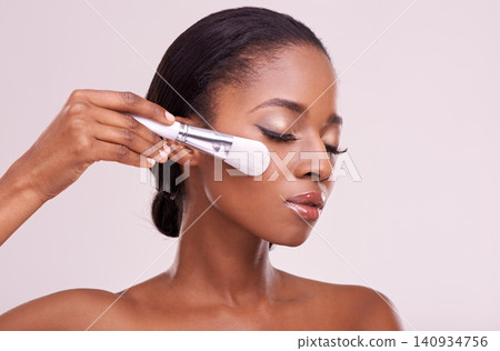 Skincare, makeup and black woman with brush on face in studio mockup with cosmetic application tool. Beauty, blush and cosmetics, facial skin care model with luxury glow product on grey background. 140934756