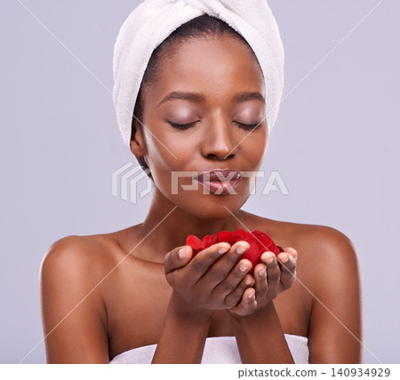 Towel, skincare and black woman with red petals, beauty and dermatology on a white studio background. Happy, African person and model with natural cosmetics and grooming with treatment and luxury Towel, skincare and black woman with red petals, beauty and dermatology on a white studio background. Happy, African person and model with natural cosmetics and grooming with treatment and luxury 140934929