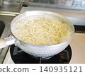 Ramen noodles boiling in a pot 140935121