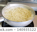 Ramen noodles boiling in a pot 140935122