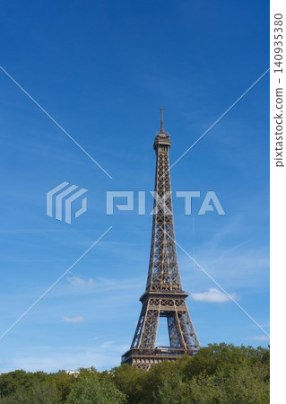 Eiffel Tower, view from bridge in Paris, La tour Eiffel from Pont de Bir-Hakeim. Vertical background with copy space for travel agency. Famous european sights Eiffel Tower, view from bridge in Paris, La tour Eiffel from Pont de Bir-Hakeim. Vertical background with copy space for travel agency. Famous european sights 140935380