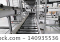 packing line in a logistics warehouse. conveyor belt in a modern production line. Pallet racking 140935536