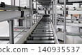 packing line in a logistics warehouse. conveyor belt in a modern production line. Pallet racking 140935537