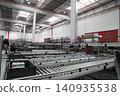 packing line in a logistics warehouse. conveyor belt in a modern production line. Pallet racking 140935538