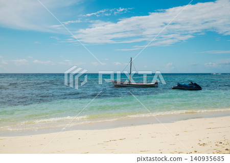 Small wooden boat in turquoise exotic ocean in Maldives paradise island. Small wooden boat in turquoise exotic ocean in Maldives paradise island. 140935685