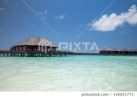 Nice beach with water bungalows at Maldives Nice beach with water bungalows at Maldives 140935771