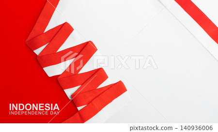 Minimalist flat lay background with a red and white ribbon celebrating Indonesian Independence Day. Features copy space. Hari Kemerdekaan, Merdeka, and Dirgahayu Indonesia on 17 Agustus Minimalist flat lay background with a red and white ribbon celebrating Indonesian Independence Day. Features copy space. Hari Kemerdekaan, Merdeka, and Dirgahayu Indonesia on 17 Agustus 140936006