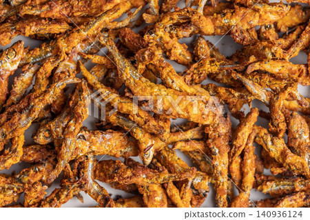 Crispy Fried Anchovies Snack Pile With Golden Crunchy Coating Close-Up Food Photo Crispy Fried Anchovies Snack Pile With Golden Crunchy Coating Close-Up Food Photo 140936124