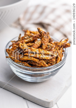 Crispy Fried smelts in Glass Bowl, Crunchy Seafood Snack and Savory Appetizer Close-Up Crispy Fried smelts in Glass Bowl, Crunchy Seafood Snack and Savory Appetizer Close-Up 140936129