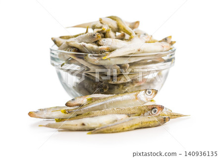 Pile of Small Frozen Fish Smelt on White Background Raw Seafood Pile of Small Frozen Fish Smelt on White Background Raw Seafood 140936135