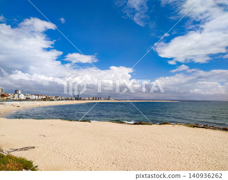 This peaceful coastal landscape with nobody features a wide golden sandy beach, deep blue ocean waves, and a dramatic cloudy sky, evoking an uplifting sense of calm freedom. This peaceful coastal landscape with nobody features a wide golden sandy beach, deep blue ocean waves, and a dramatic cloudy sky, evoking an uplifting sense of calm freedom. 140936262