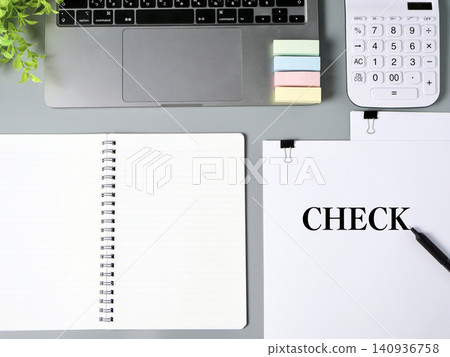 Business materials featuring a laptop and a notebook/calculator, inspired by the word "CHECK". 140936758