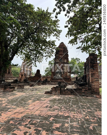 Vertical View Of Historic Brick Courtyard At Wat Mahathat Ruin Vertical View Of Historic Brick Courtyard At Wat Mahathat Ruin 140936800
