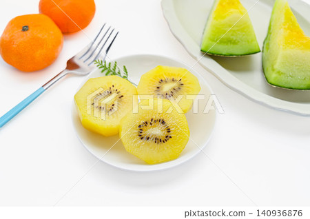 Cutting a golden kiwi Cutting a golden kiwi 140936876