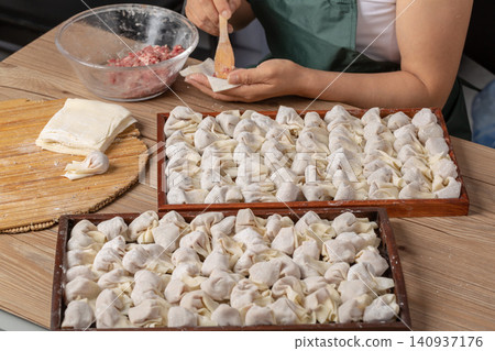 raw Wrapped Wontons Ready for Cooking, Traditional Chinese Dumplings 140937176