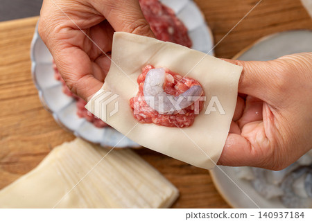 handmade Wonton Wrapping Process, Traditional Chinese Dumpling Making handmade Wonton Wrapping Process, Traditional Chinese Dumpling Making 140937184