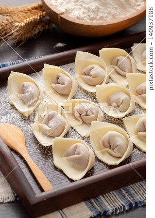 raw Wrapped Wontons, Traditional Chinese Dumplings Ready for Cooking 140937188