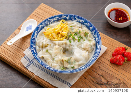 pork Wontons in Clear Broth, Traditional Chinese Dumpling Soup pork Wontons in Clear Broth, Traditional Chinese Dumpling Soup 140937198