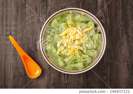 spinach Wontons in Light Soup, Chinese Green Vegetable Dumpling spinach Wontons in Light Soup, Chinese Green Vegetable Dumpling 140937222