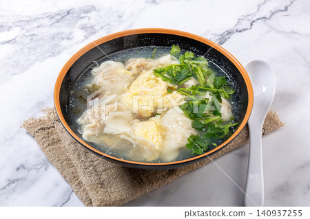 beef Wontons in Water Chestnut Soup, Traditional Chinese Dumpling Soup beef Wontons in Water Chestnut Soup, Traditional Chinese Dumpling Soup 140937255
