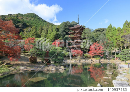 A five-story pagoda under a clear autumn sky, with beautiful autumn leaves. A five-story pagoda under a clear autumn sky, with beautiful autumn leaves. 140937383