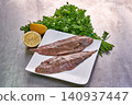 Sole fish on a white plate with parsley and lemon 140937447