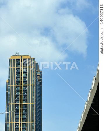 Urban Landscape With Residential Tower And Concrete Flyover Bridge Urban Landscape With Residential Tower And Concrete Flyover Bridge 140937518