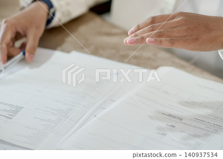 Islamic Marriage Contract Ceremony (Akad Nikah) - Religious Officiant Joining Hands with Groom During Ijab Qabul Ritual Islamic Marriage Contract Ceremony (Akad Nikah) - Religious Officiant Joining Hands with Groom During Ijab Qabul Ritual 140937534