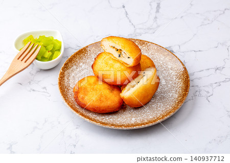 traditional Chinese Deep Fried Sweet Sugar Cakes, Crispy Golden Tanggao Pastry with Liquid Fillings traditional Chinese Deep Fried Sweet Sugar Cakes, Crispy Golden Tanggao Pastry with Liquid Fillings 140937712